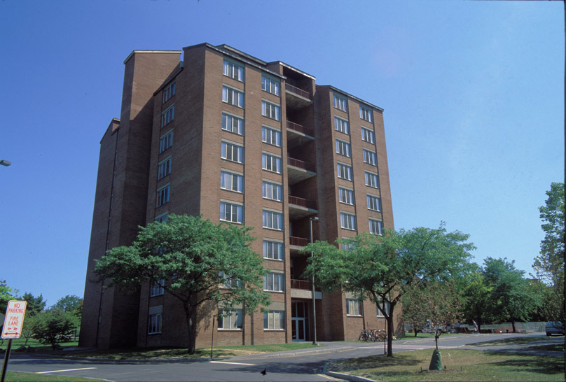Tall Jameson Hall building nestled between green trees