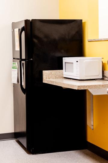 kitchen with a microwave and a fridge