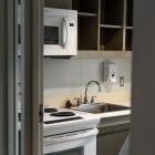 kitchen with microwave, stove, and sink